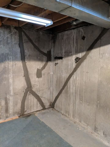 Completed foundation crack repair in Cold Lake basement with waterproofed interior wall